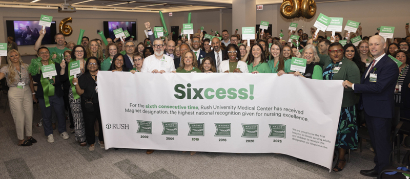 Photo of Rush nurses holding a banner celebrating 6 consecutive Magnet designation recognitions