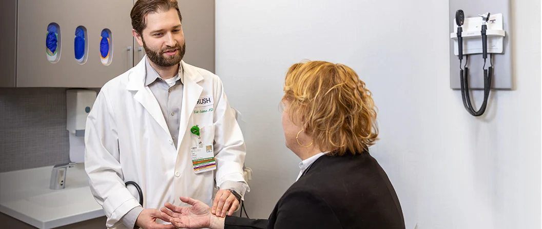 Rush primary care doctor with a patient