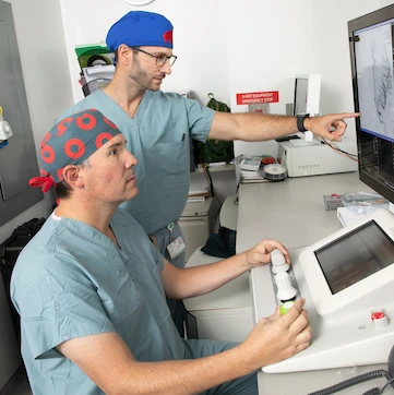 Dr. Crowley and Dr. Munich performing a procedure