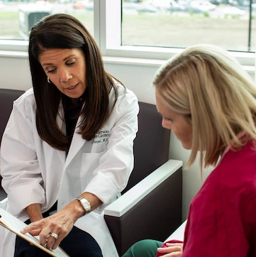 Rush oncologist with a patient