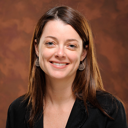 elisabeth lynch posed in front of a brown background