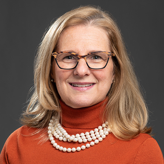 frances lee posed in front of gray background