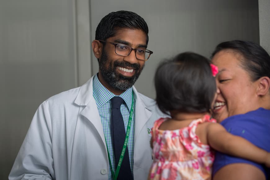 Dr. Kesavan with a patient
