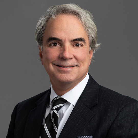 lorenzo munoz posed in front of a gray background