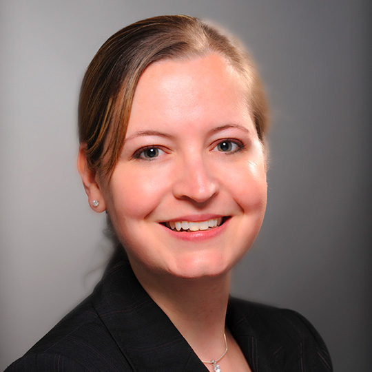 patricia boyle posed in front of a gray background