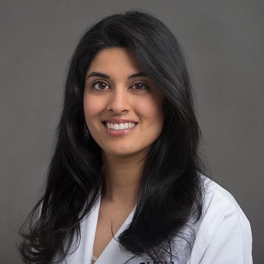 prema nanavaty posed in front of gray background