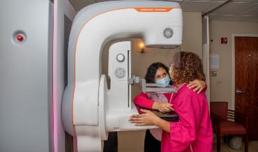Patient receiving a mammogram