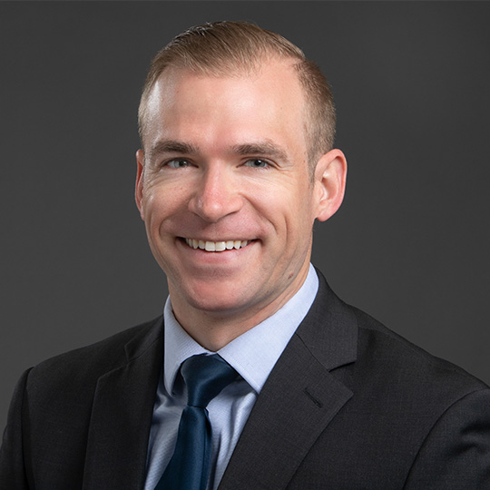 sean swearingen posed in front of gray background