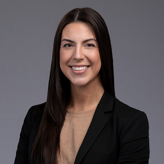 stephanie schroeder posed in front of gray background