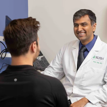 Rush urologist with a patient