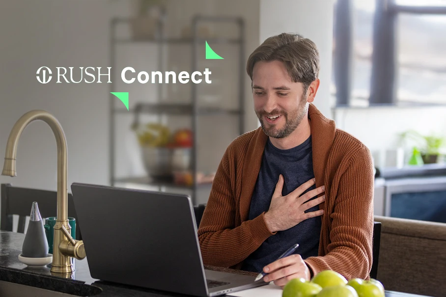 Man using a laptop for telehealth