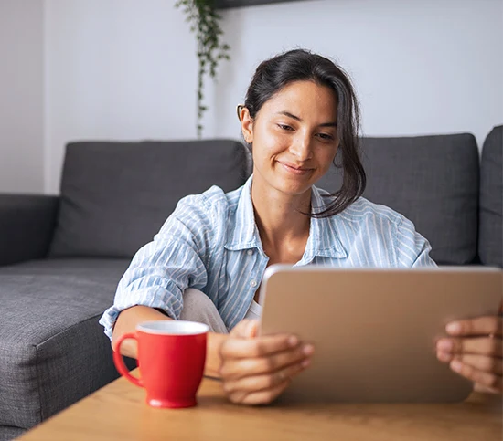 Woman using a tablet for telehealth