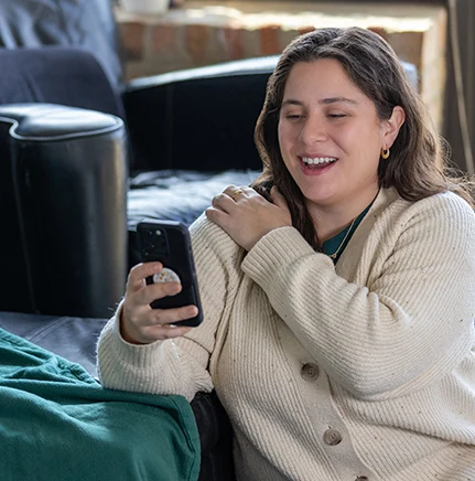 Woman using a phone for telehealth