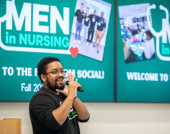 A man speaking into a microphone