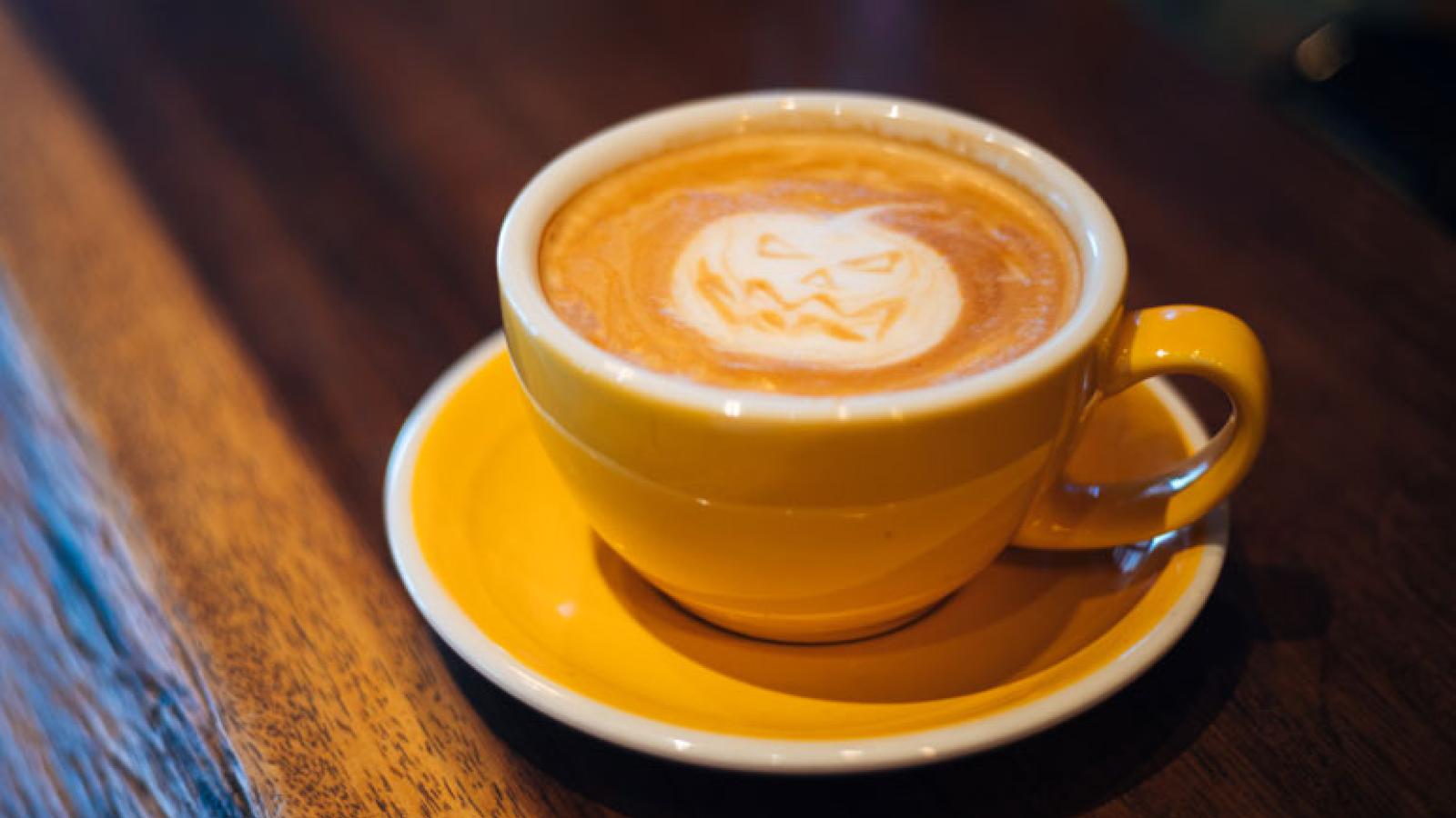 Cup of Pumpkin Spice Latte With Pumpkin Decoration 