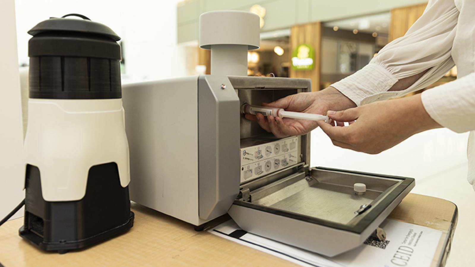 An air detection device is opened to remove samples