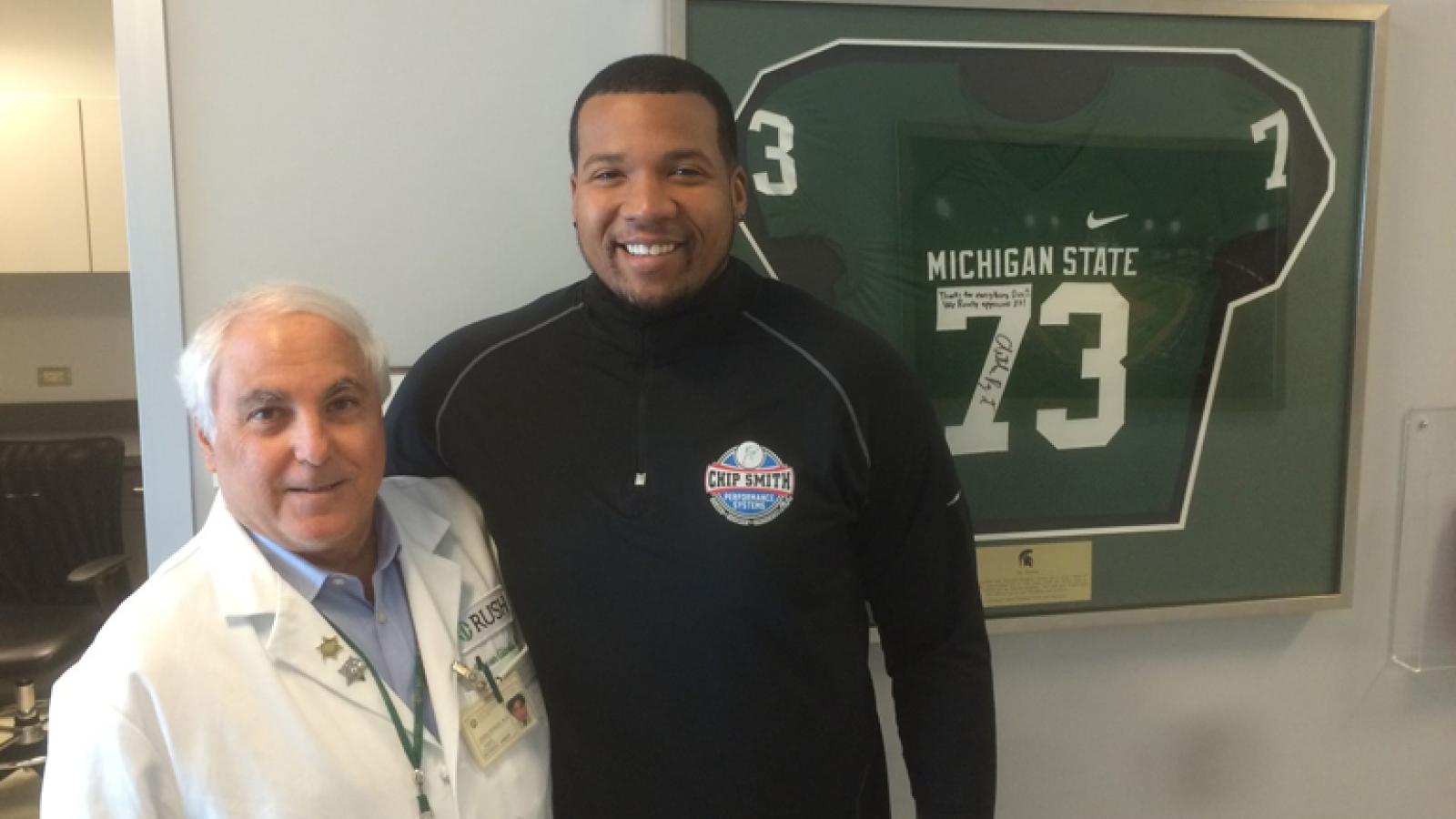 Art Ray and Dr. Steven Gitelis, MD, pose for a photo.