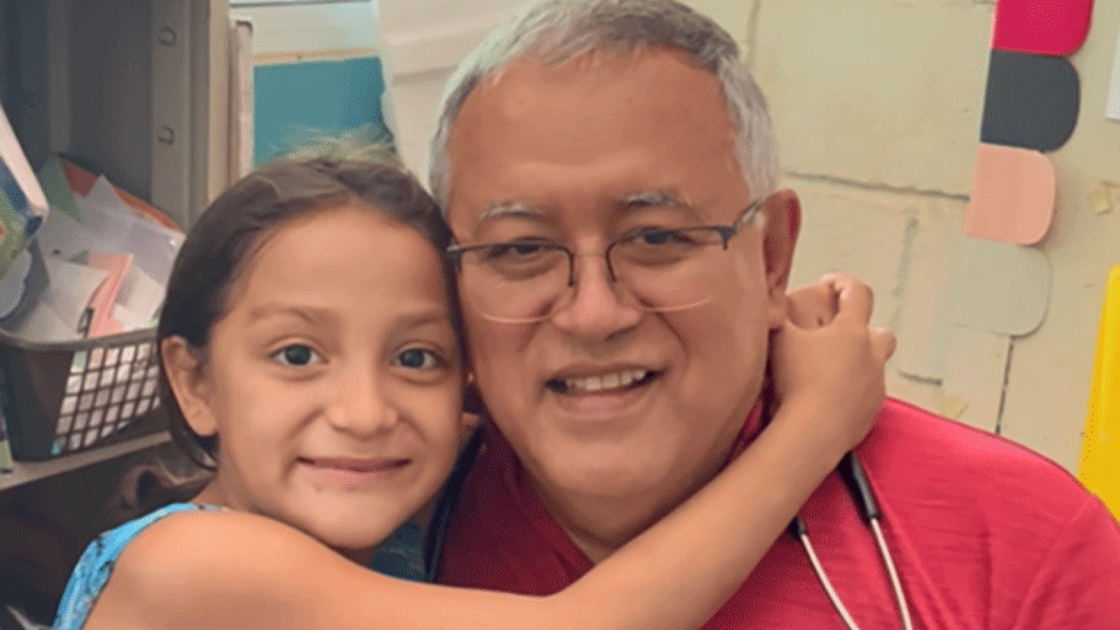 Honduras girl hugs Dr. Bolanos