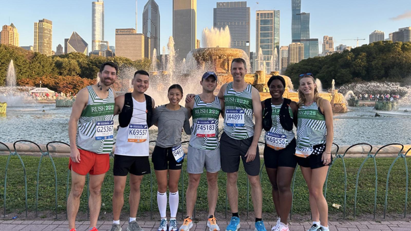 Seven members of Team Rush stand in front of Buckingham Fountain