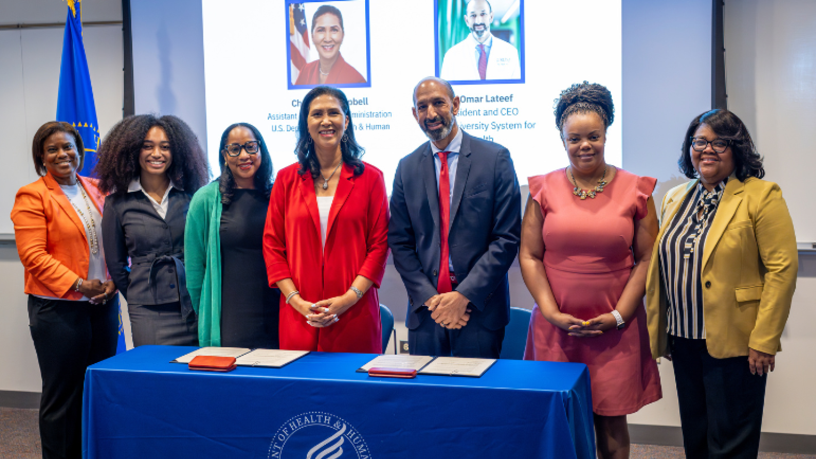 HHS Delegation and REACH signing event with Omar Lateef and Cheryl Campbell