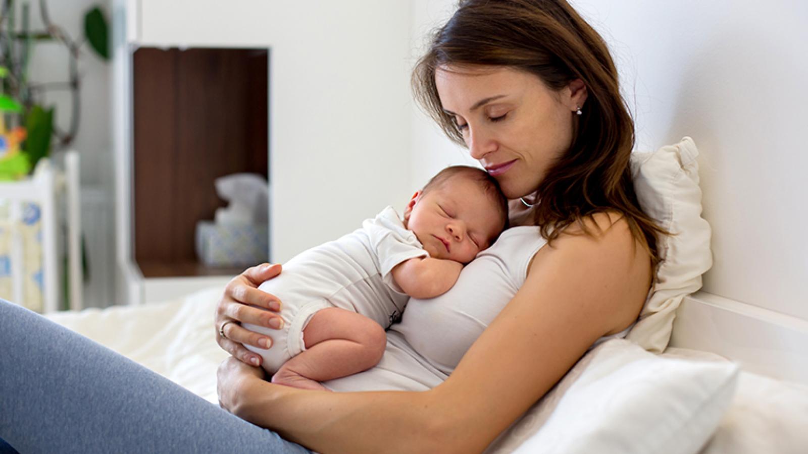 Baby and mom snuggling