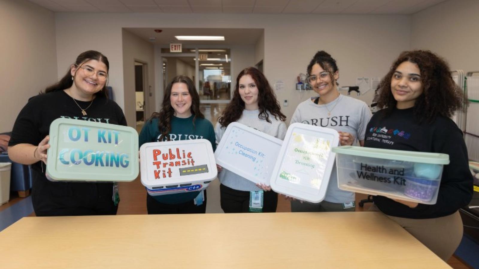 Occupational Therapy students pose with their occupation kits created for Rush Specialty Hospital.