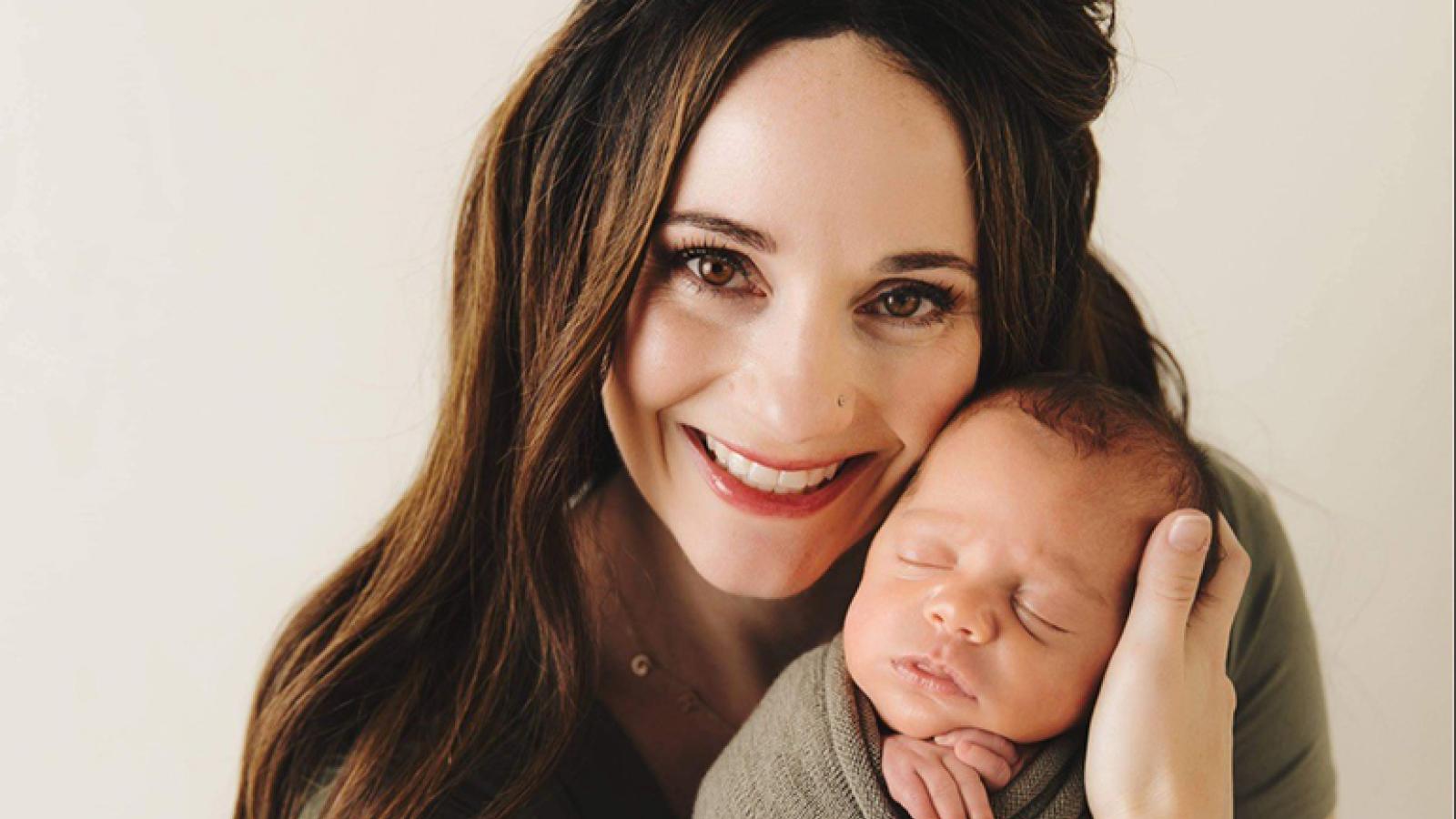 Rachel holding newborn son Graison