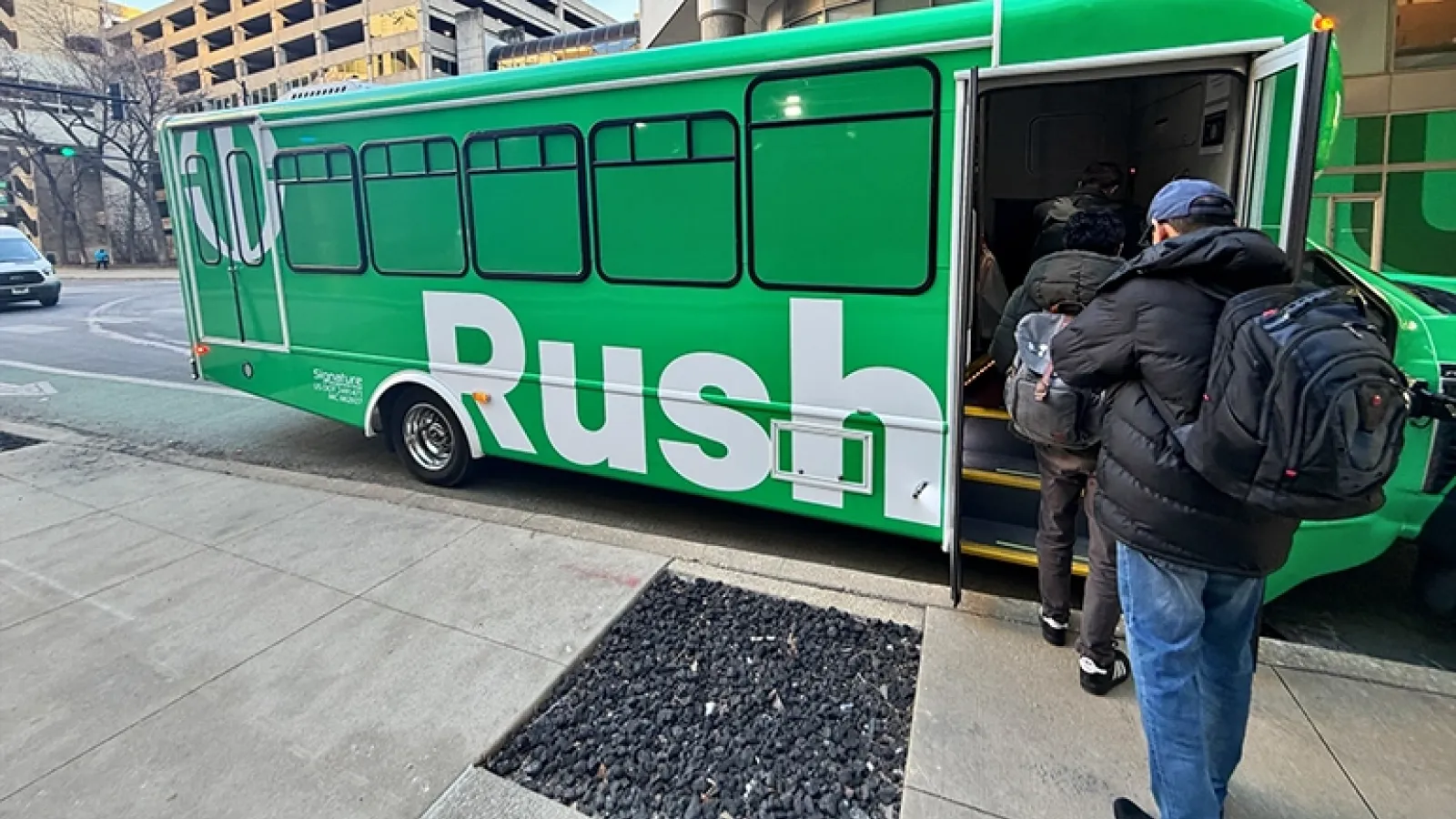 People entering a shuttle bus