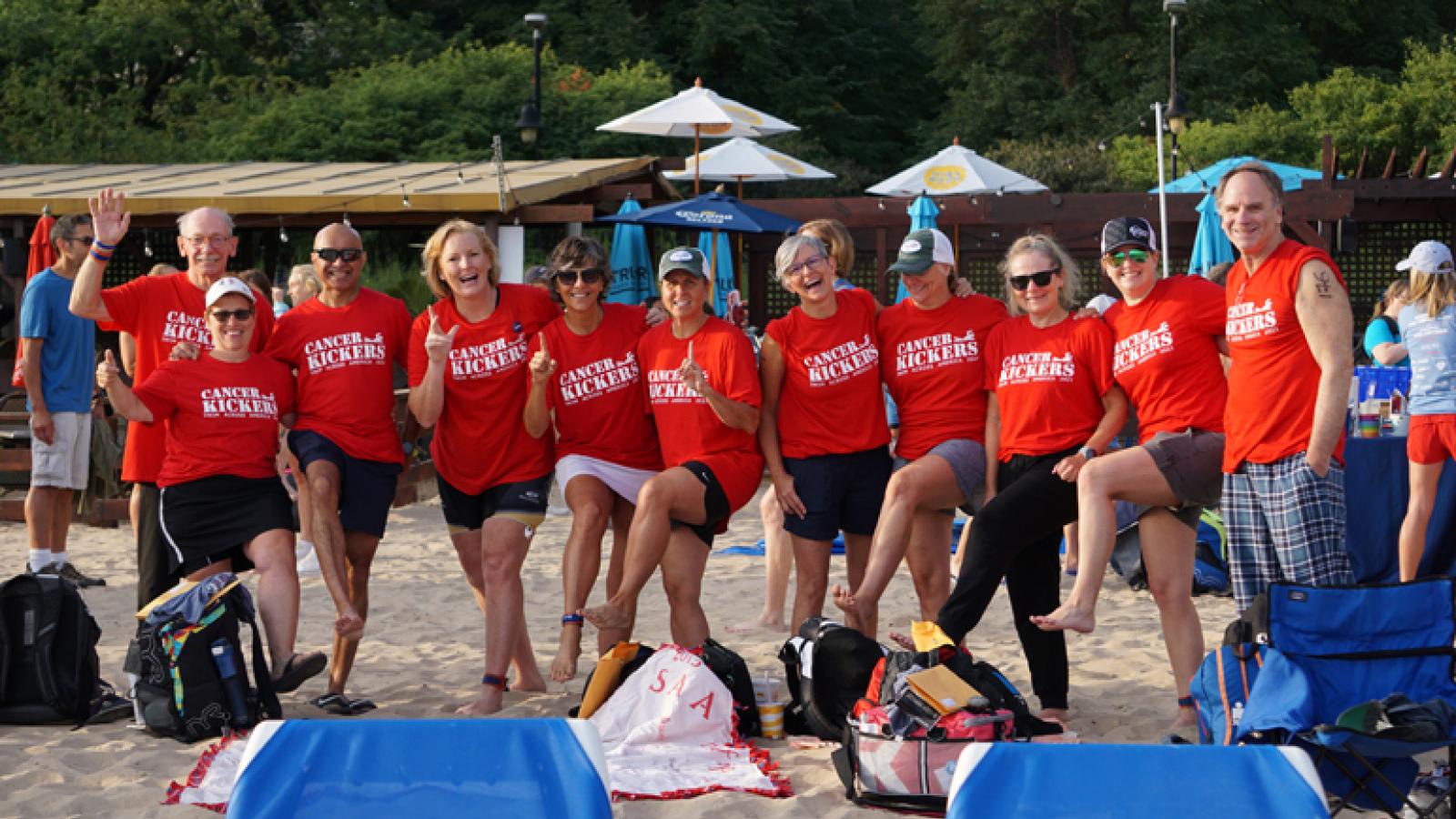 Ellen Bintz Meuch and her Swim Across America team gather for a photo