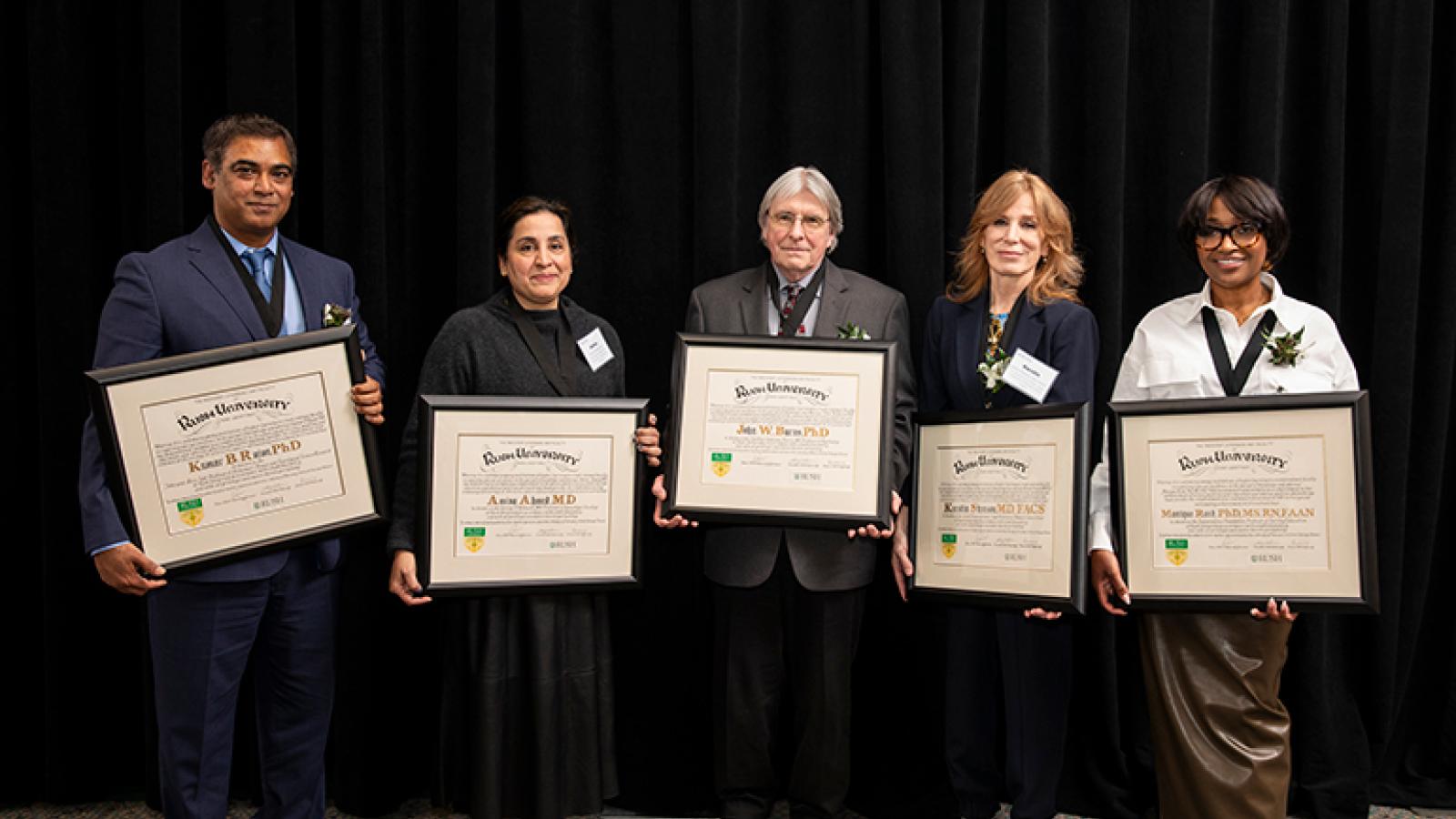 From left to right: Kumar B. Rajan, PhD; Amina Ahmed, MD; John W. Burns, PhD; Kerstin Stenson, MD, FACS; and Monique Reed, PhD, MS, RN, FAAN.