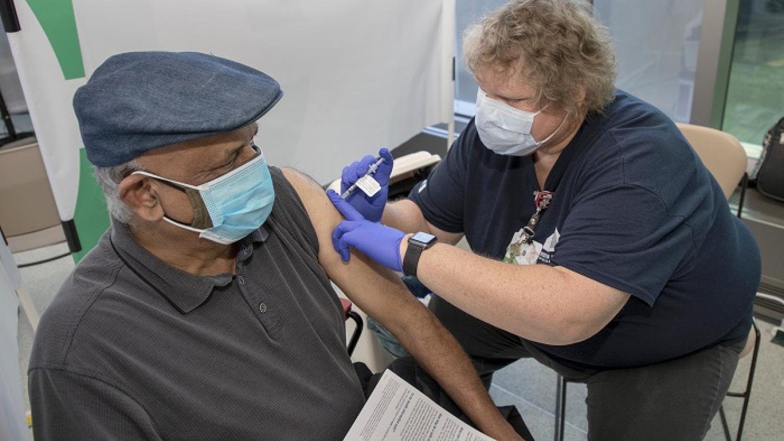 Rush to Celebrate 100,000th COVID-19 Vaccine 