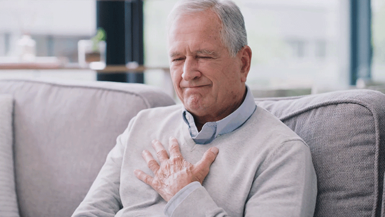 Man holding chest