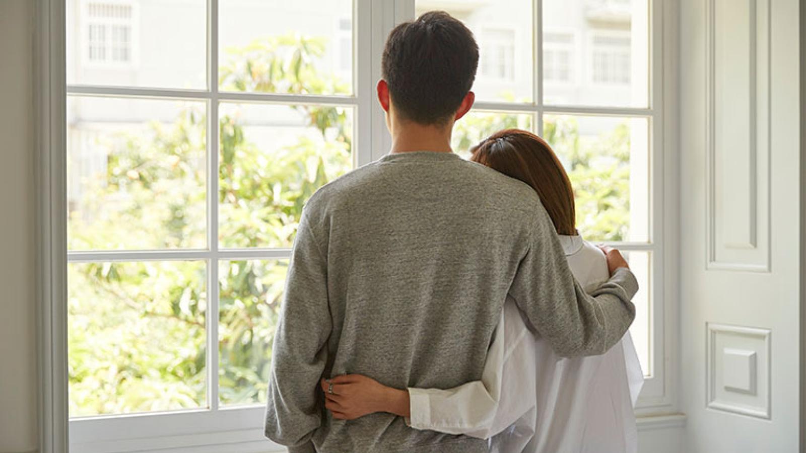 Couple looking out window