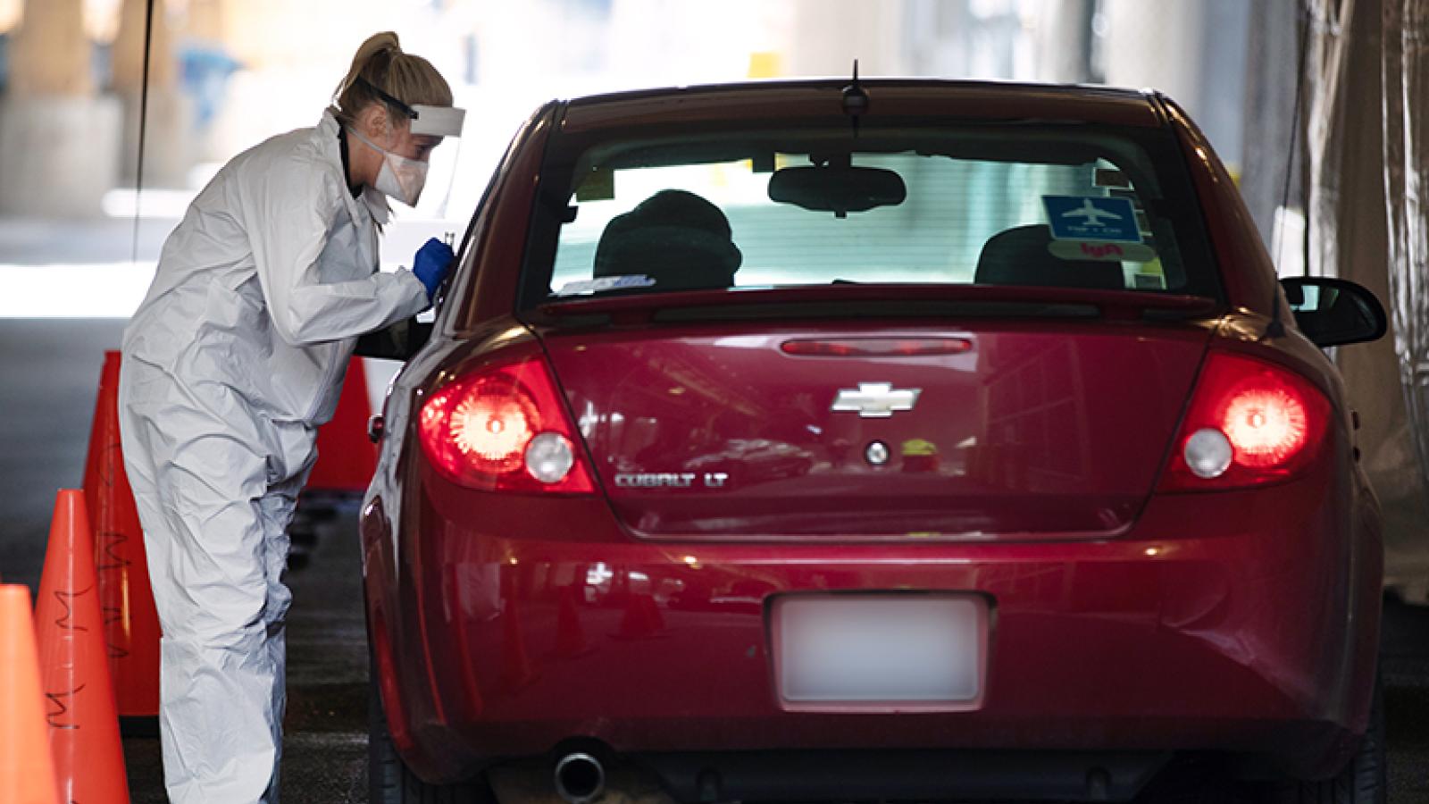 Person talking to someone in a car