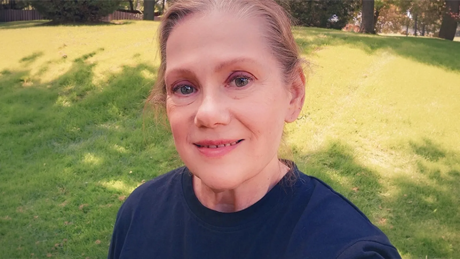 Photo of Ellen, who underwent back surgery, in her back yard