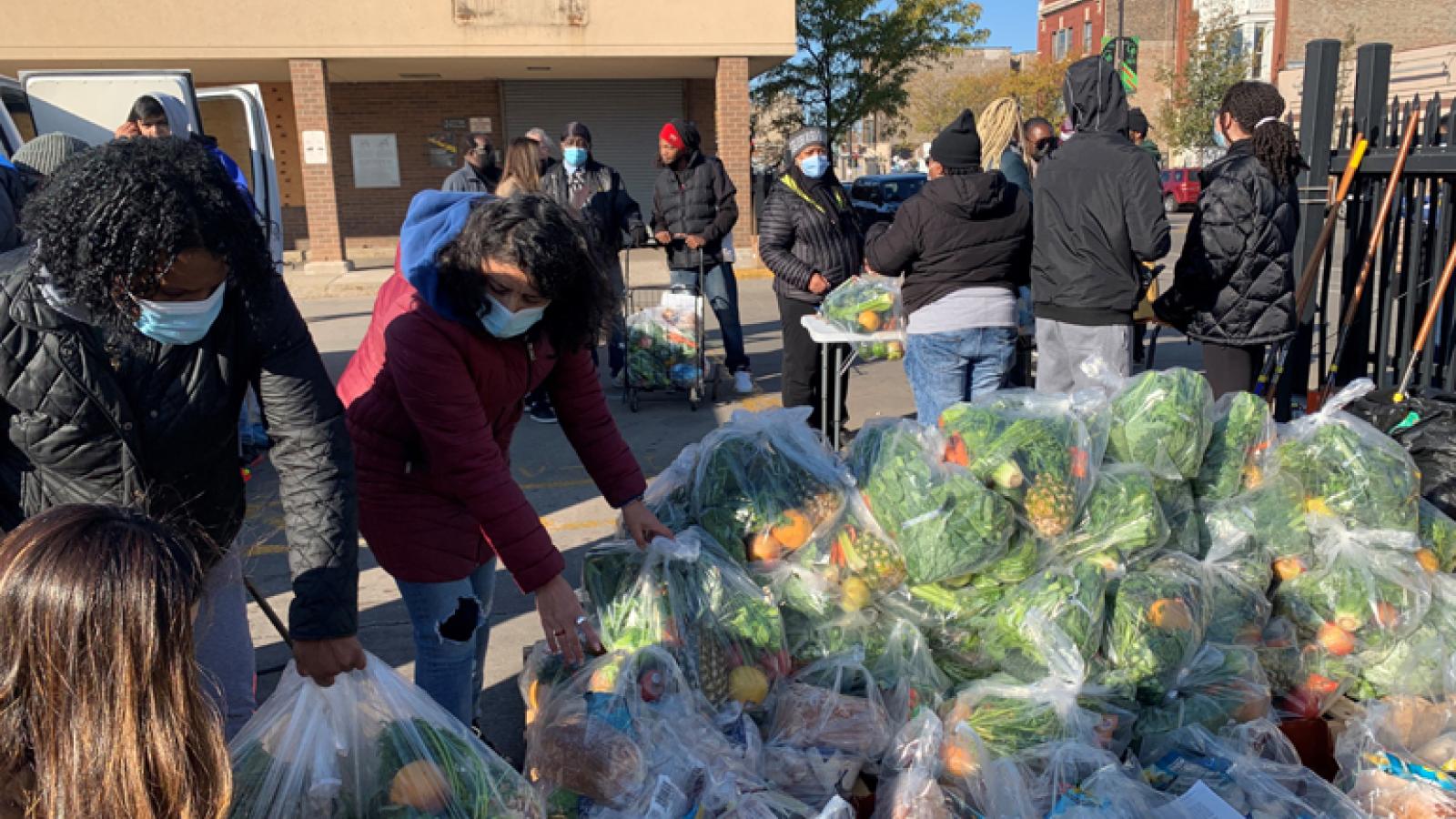 People hand out fresh food