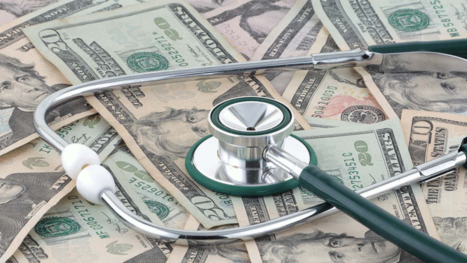Stethoscope on pile of money