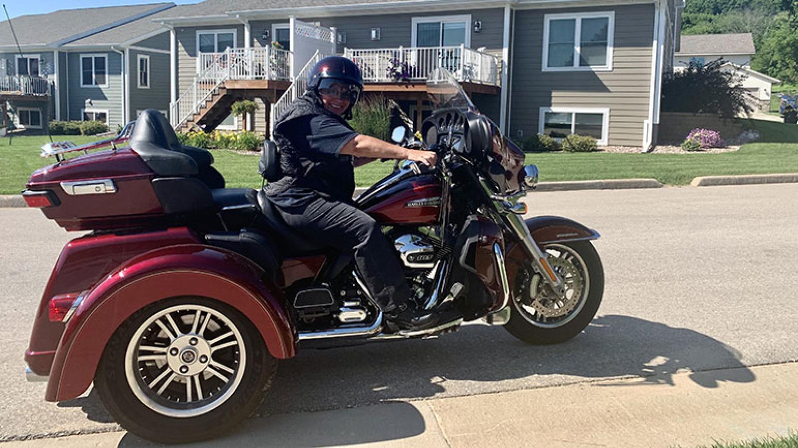 Kari Rankins riding her motorcycle