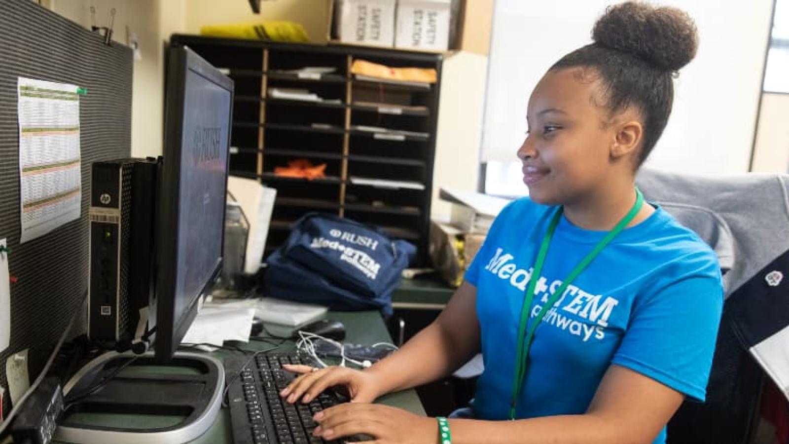Kyla McDaniel working at a computer