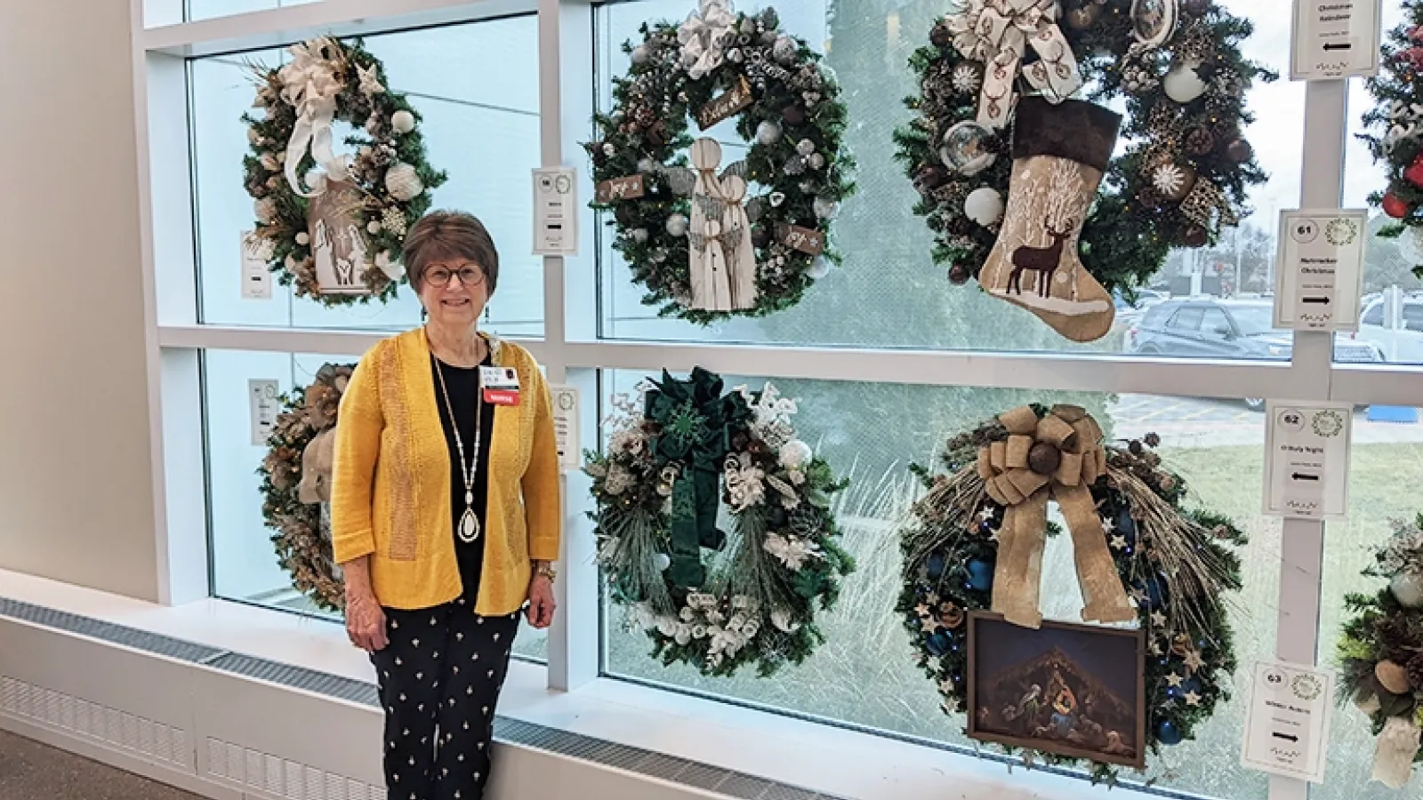 Louise Fazio with wreaths at Rush Copley