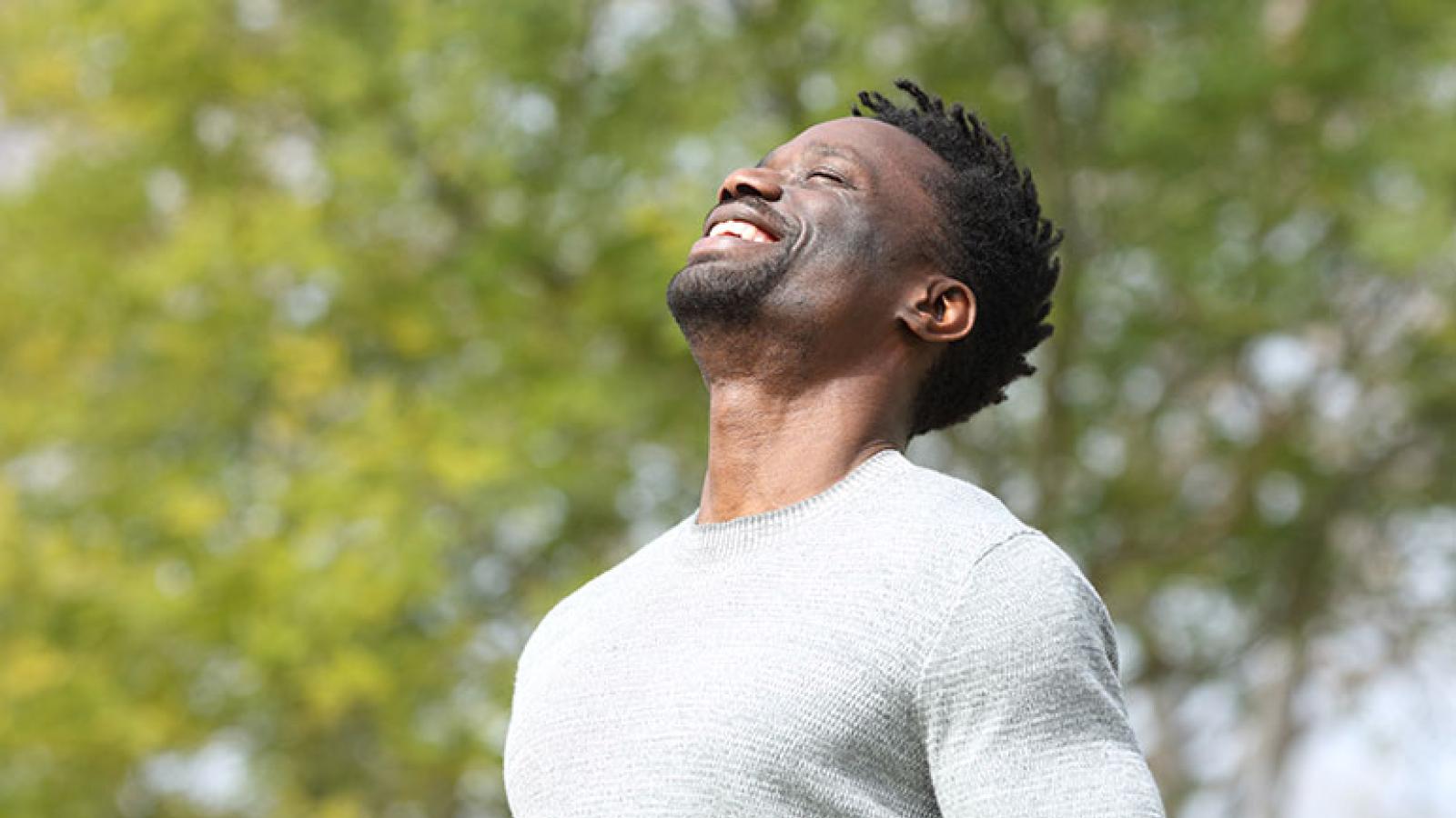Man breathing in fresh air