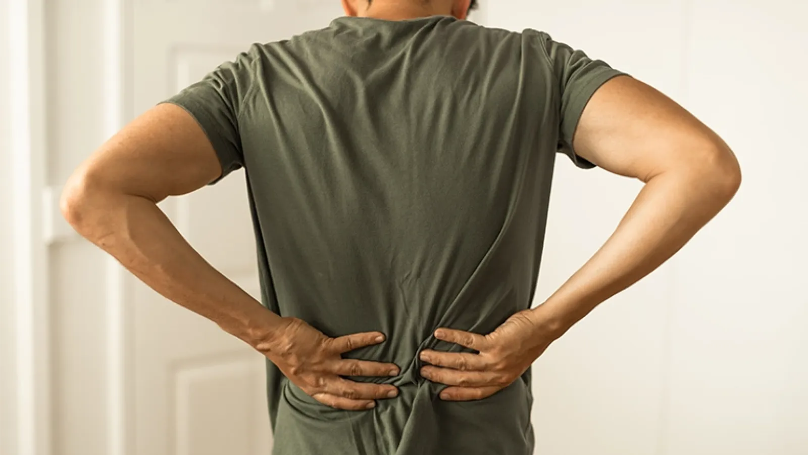 Man experiencing lower back pain