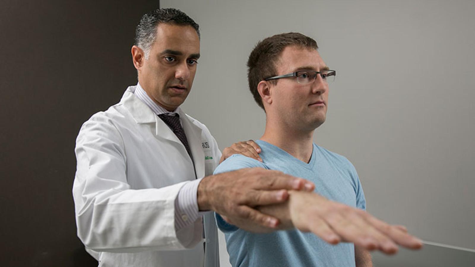 Nikhil Verma, MD, with a patient