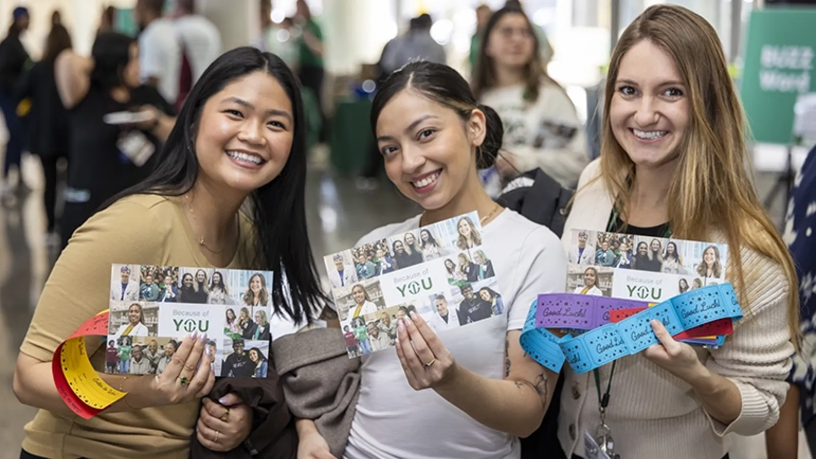 Smiling staff members at Rush Day celebration