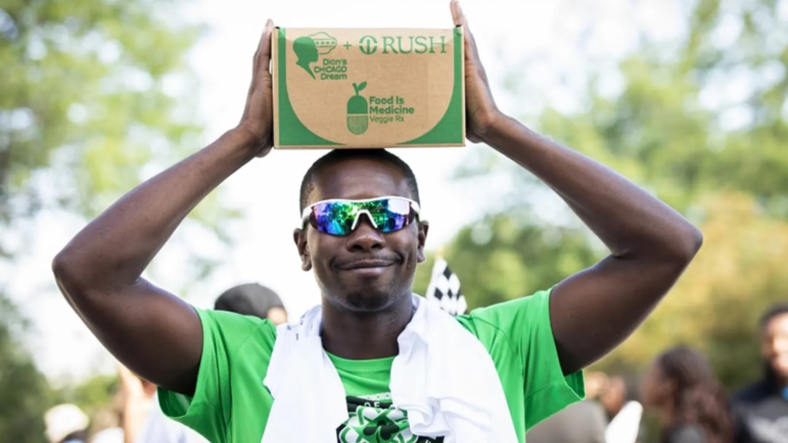 Man holding box of food on head