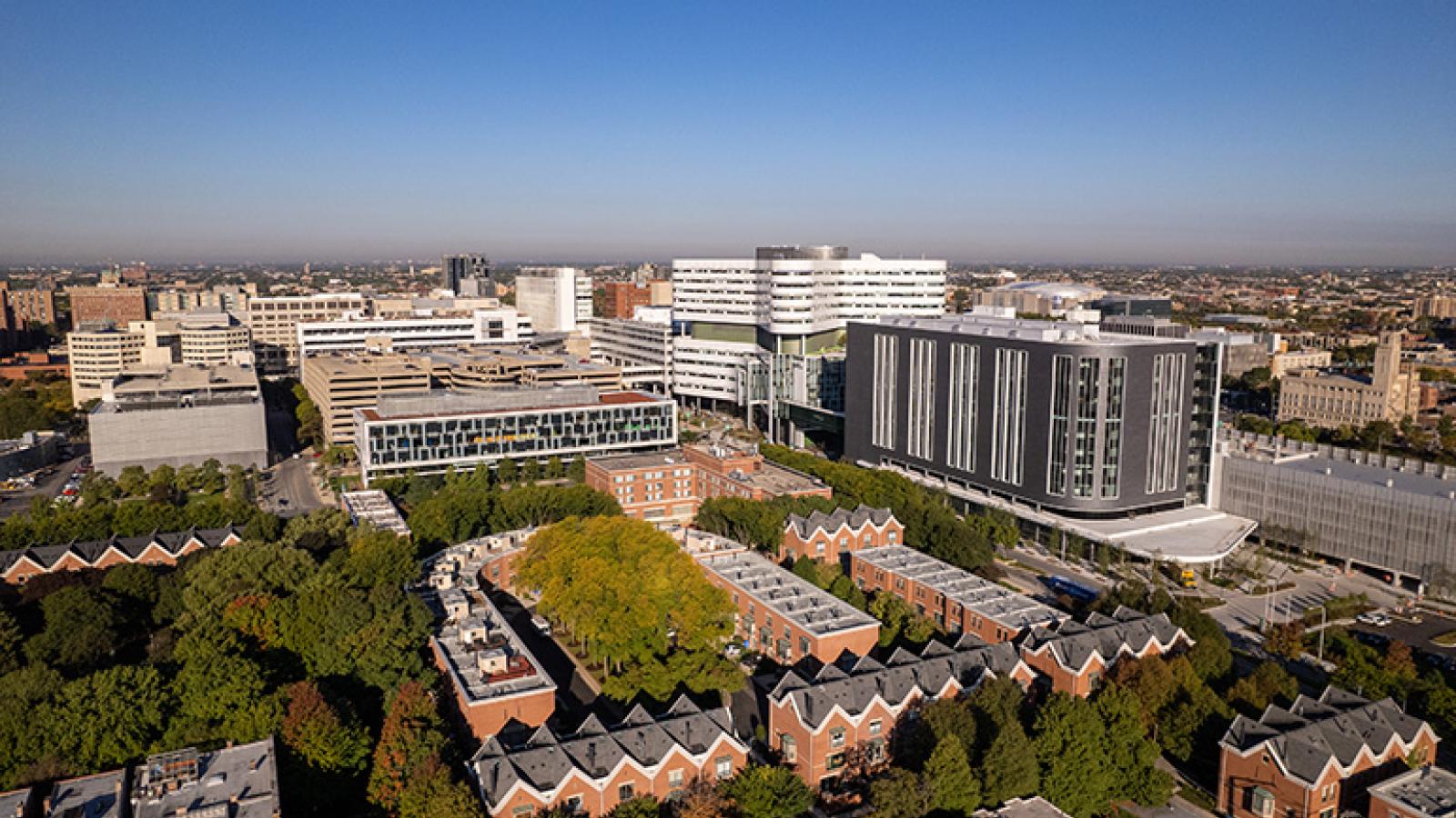 an aerial view of the RUSH campus with the south and west sides of chicago visible in the background