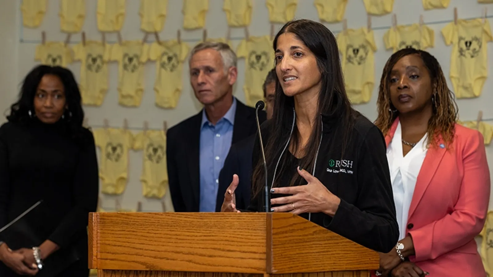 Doctor speaks to crowd