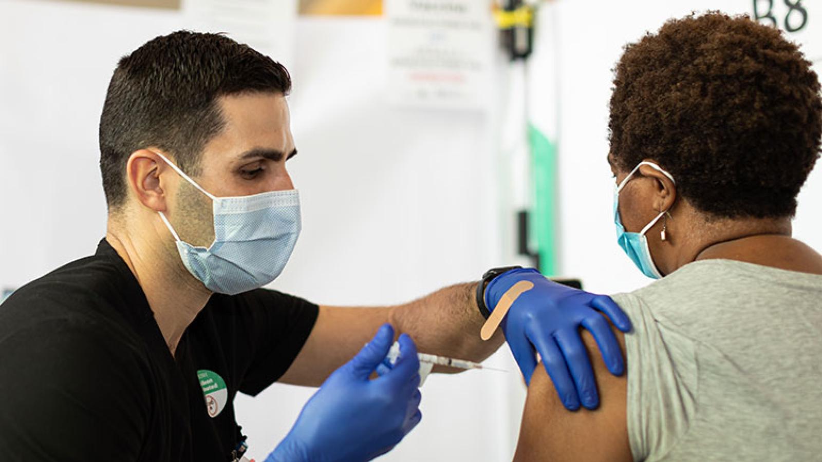 Nurse administering COVID vaccine
