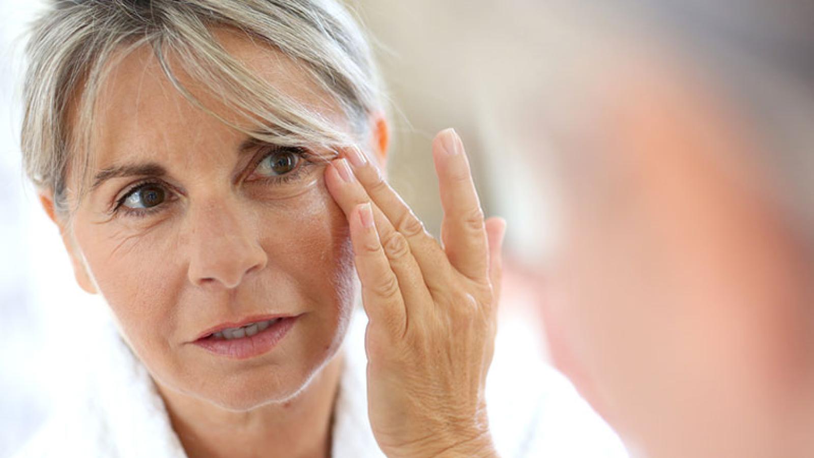 Woman applying face cream