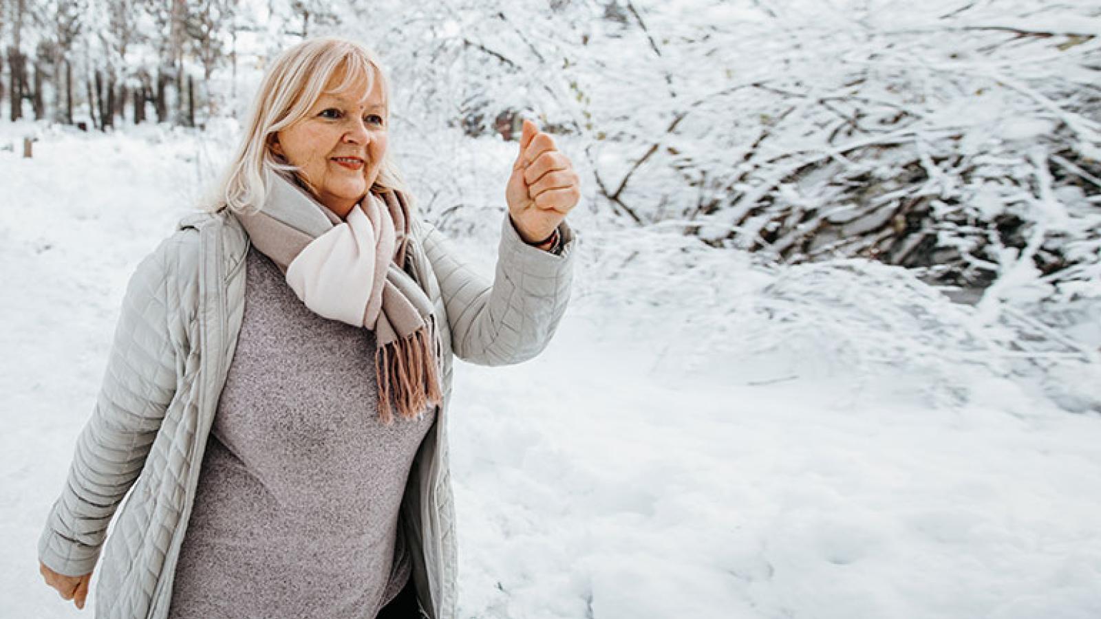 Woman walking in snow